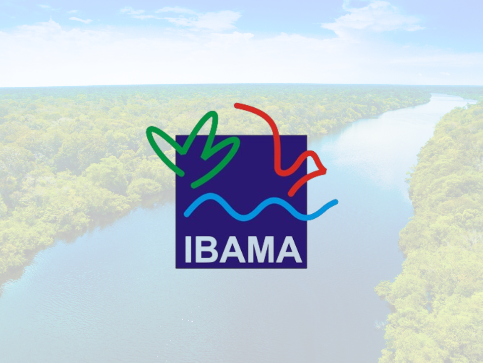 Aerial view of a large open-pit mine with terraced excavation during summer.